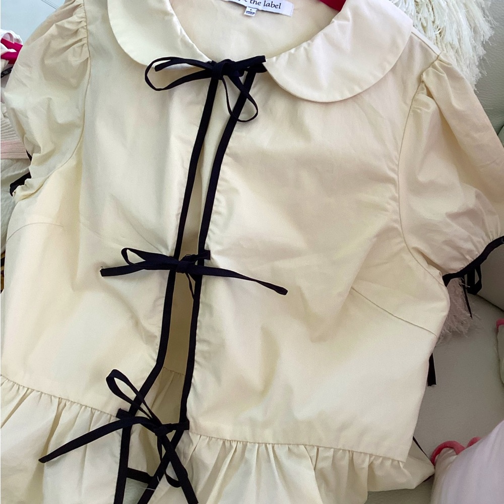Sophie the label peplum cream top with black trim L